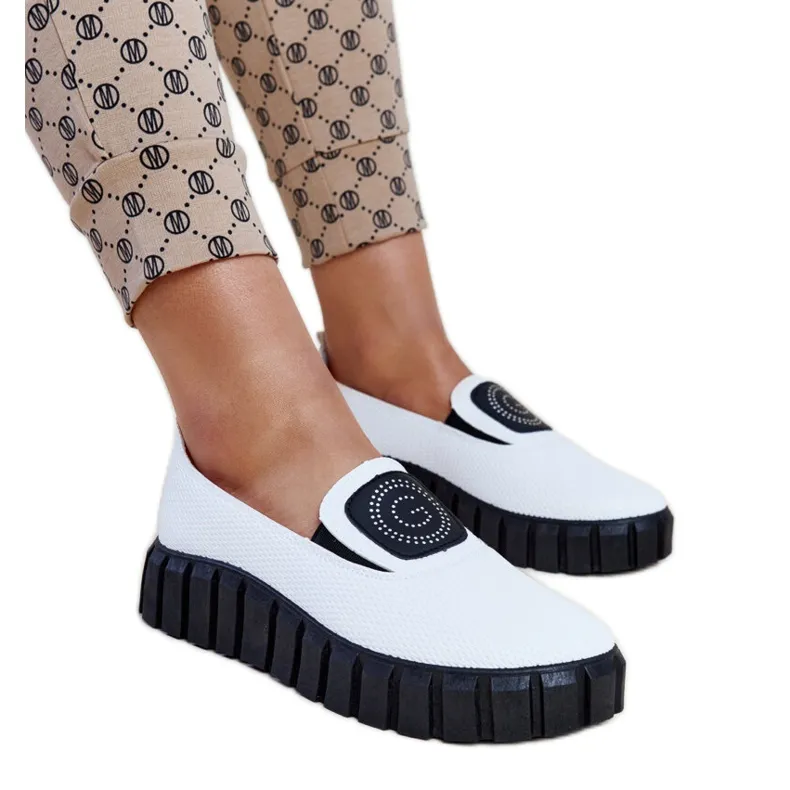 WITTE SCHOENEN MET EEN MASSIEVE TESKAZOOL